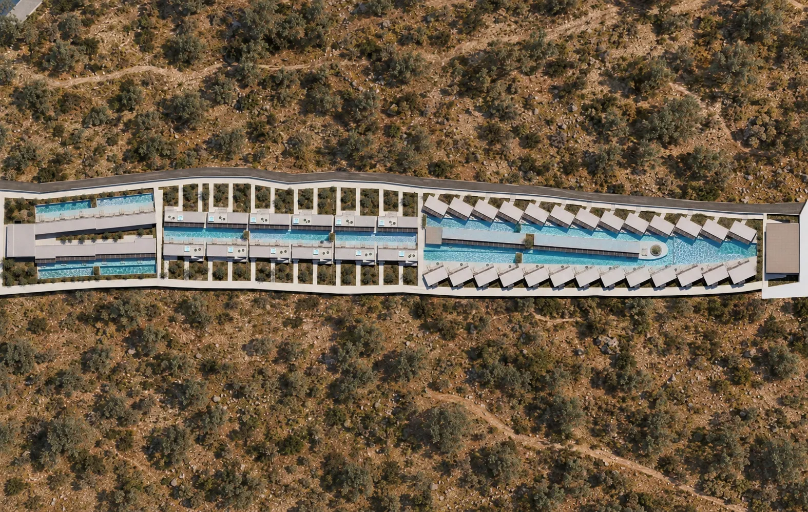Top-down aerial view of the resort's pool winding between the rooms